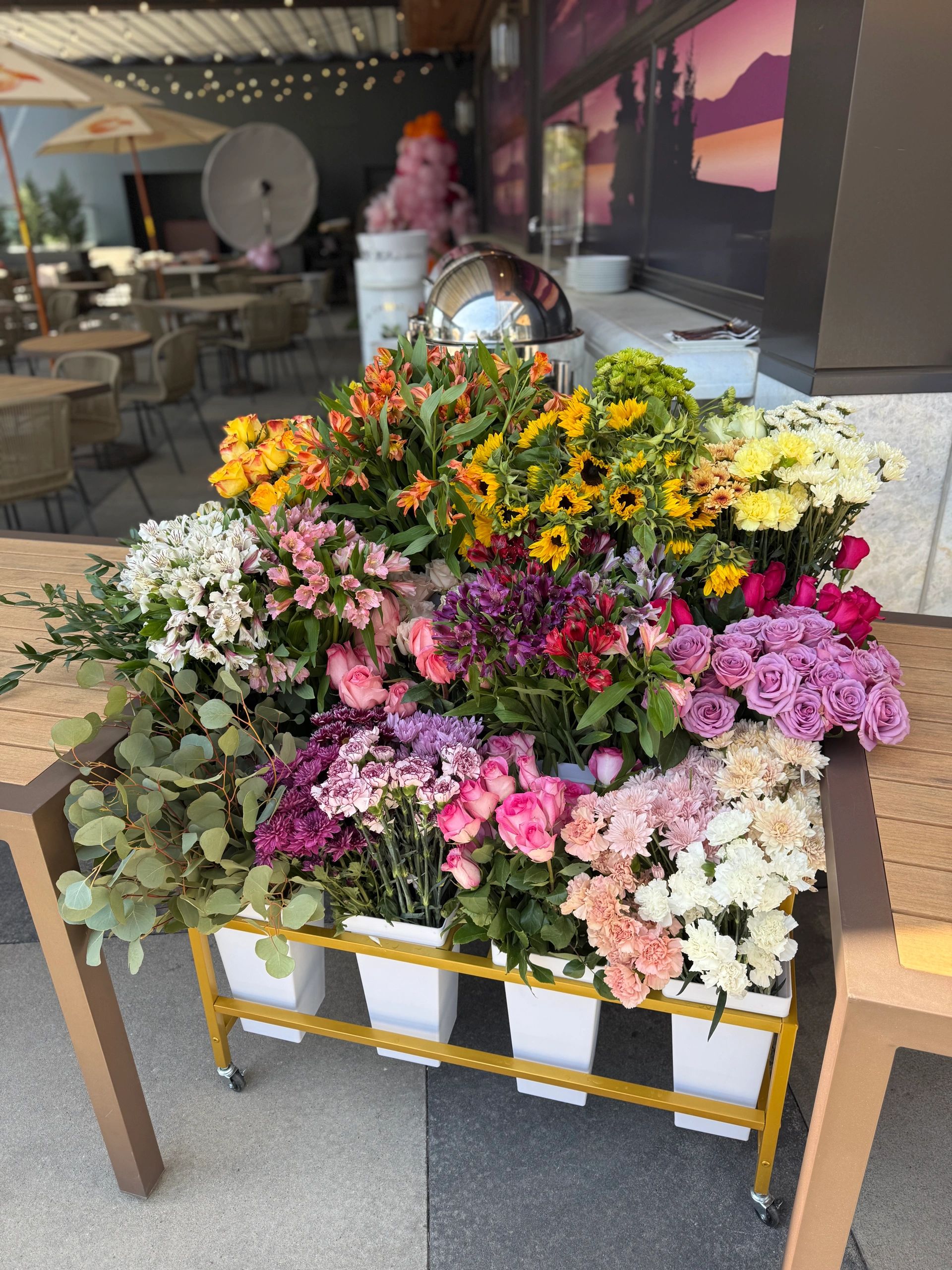 Colorful fresh flowers arranged on a flower cart